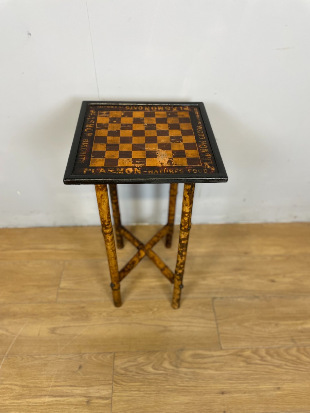 Bamboo chess table advertising Plasmon cocoa