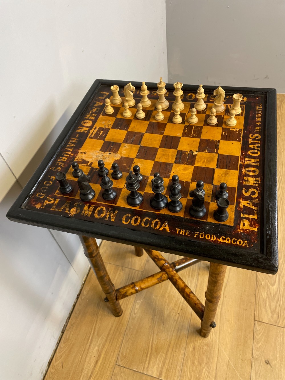 Bamboo chess table advertising Plasmon cocoa View XII