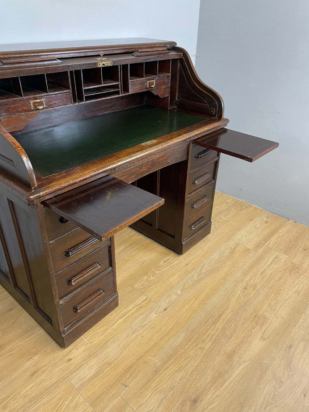 Oak twin pedestal roll top desk in original condition  View IX