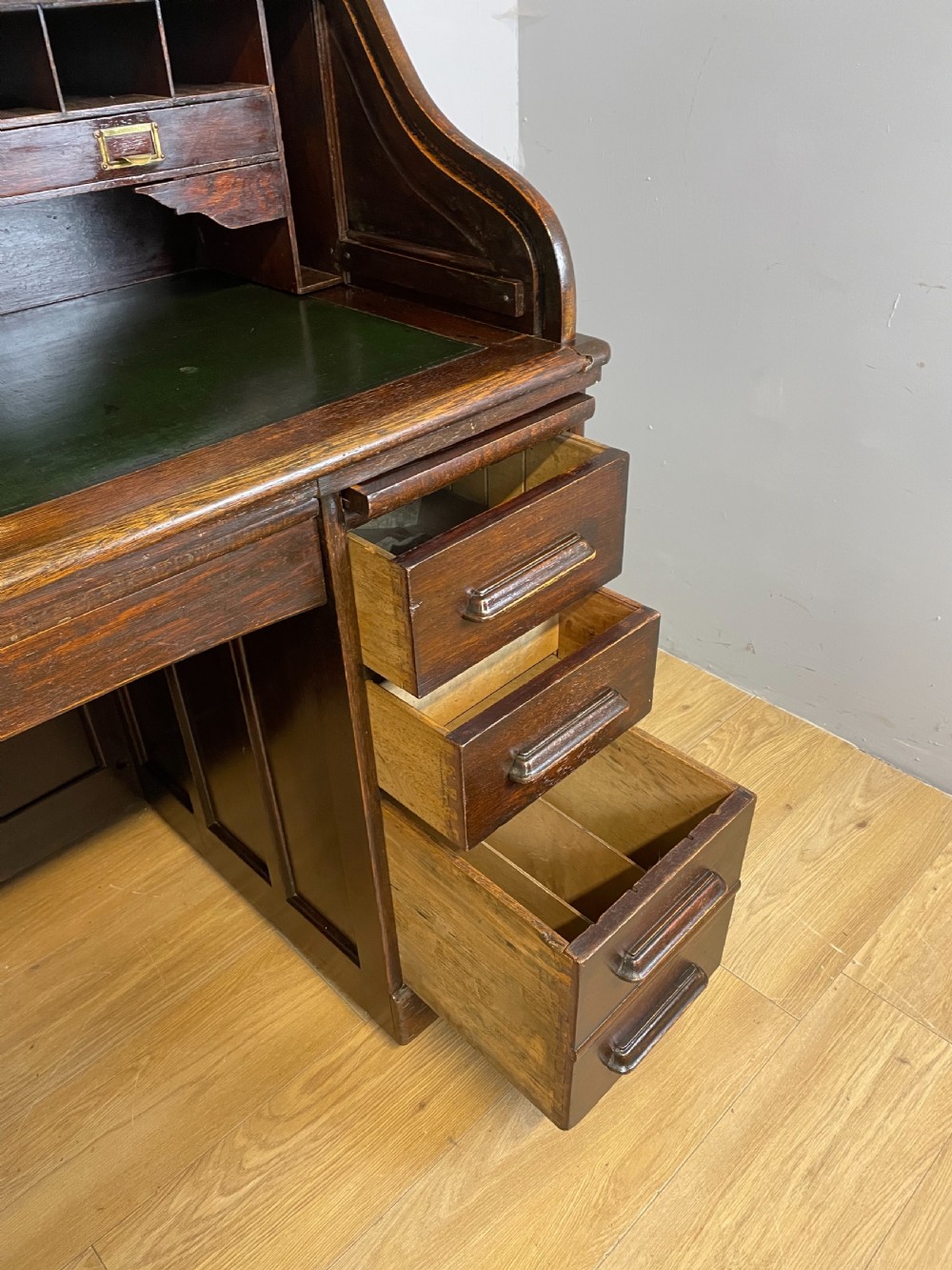Oak twin pedestal roll top desk in original condition  View X