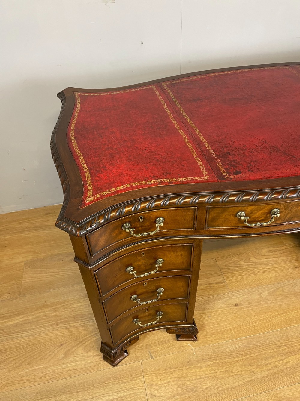 Serpentine sided Chippendale style mahogany desk with inset leather top View III