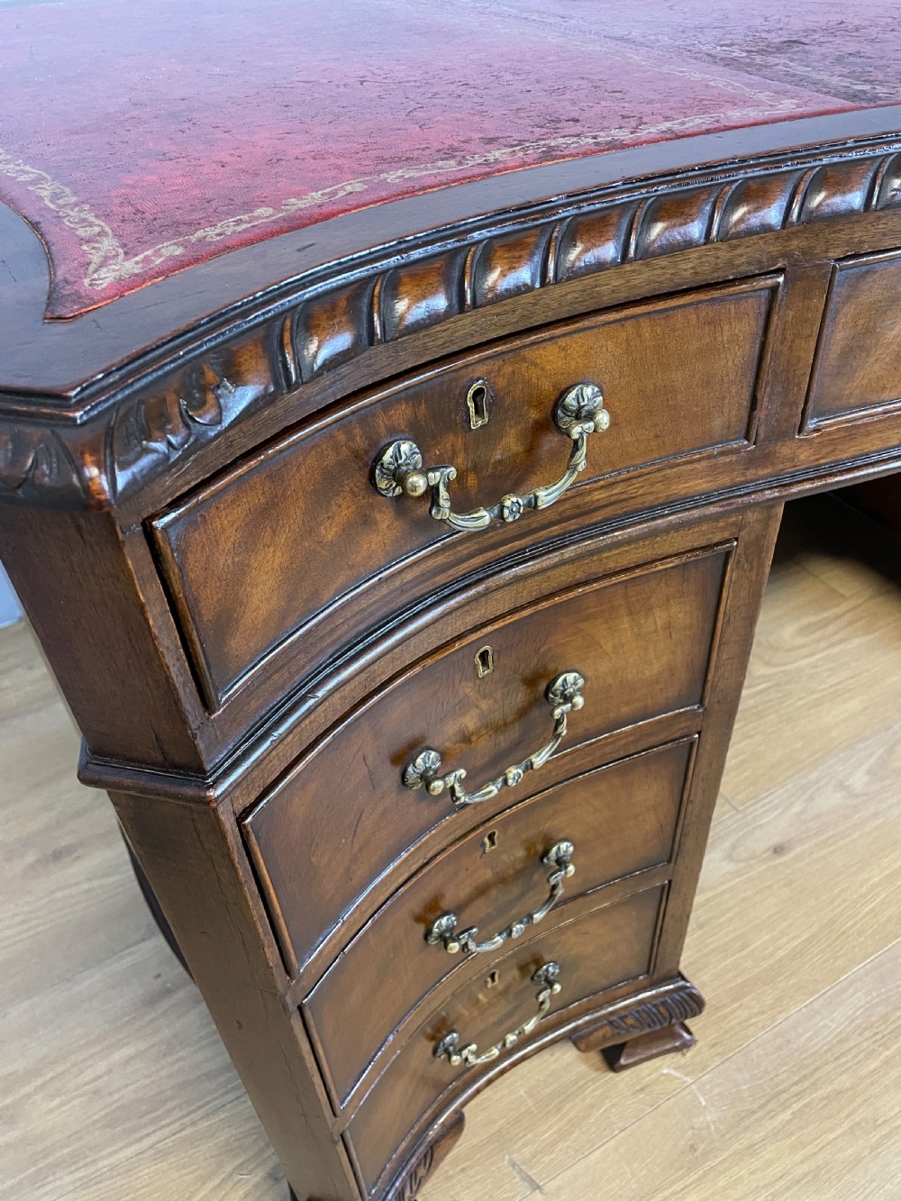 Serpentine sided Chippendale style mahogany desk with inset leather top View V