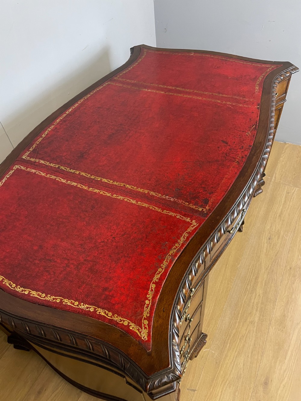 Serpentine sided Chippendale style mahogany desk with inset leather top View VII