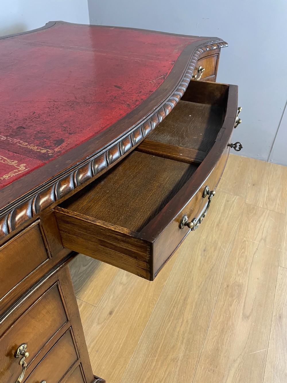 Serpentine sided Chippendale style mahogany desk with inset leather top View VIII