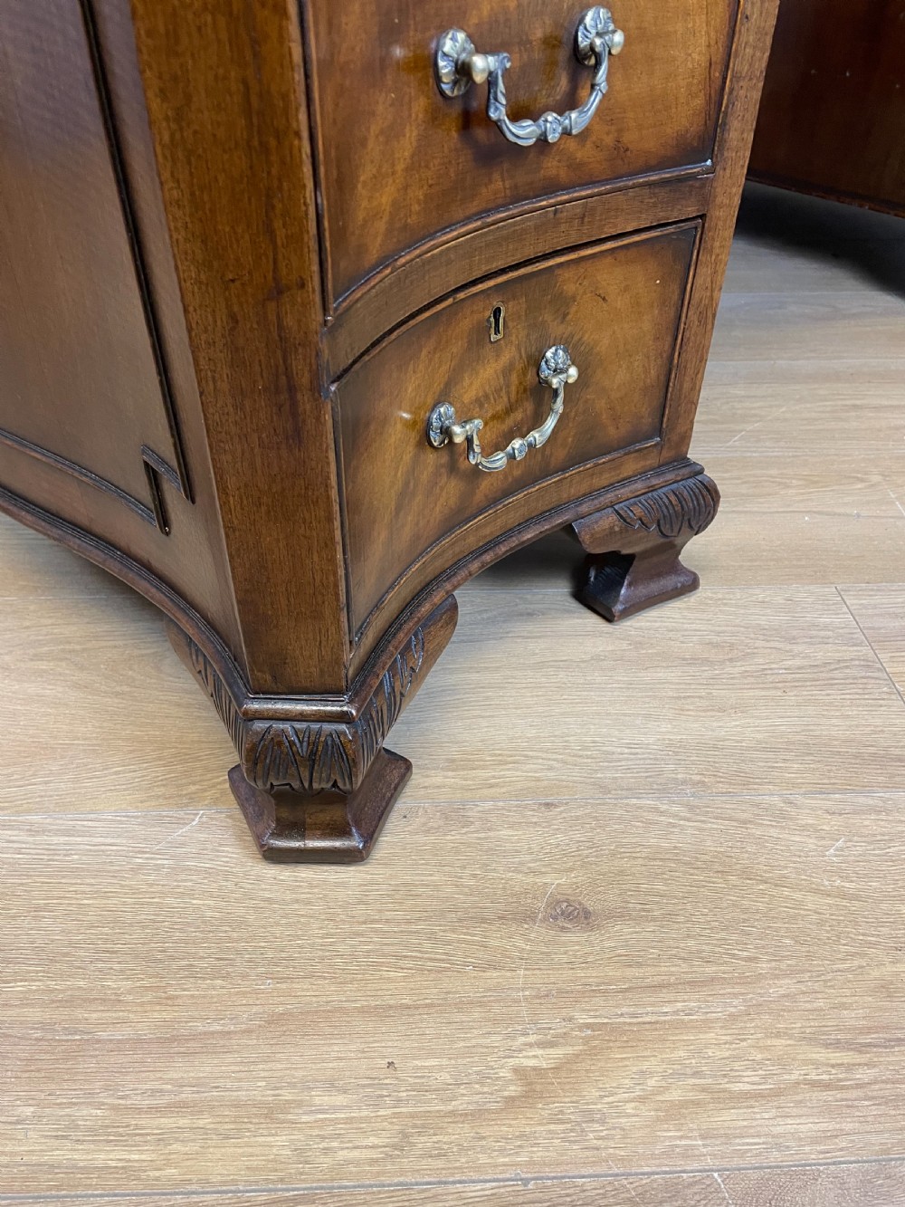 Serpentine sided Chippendale style mahogany desk with inset leather top View XII