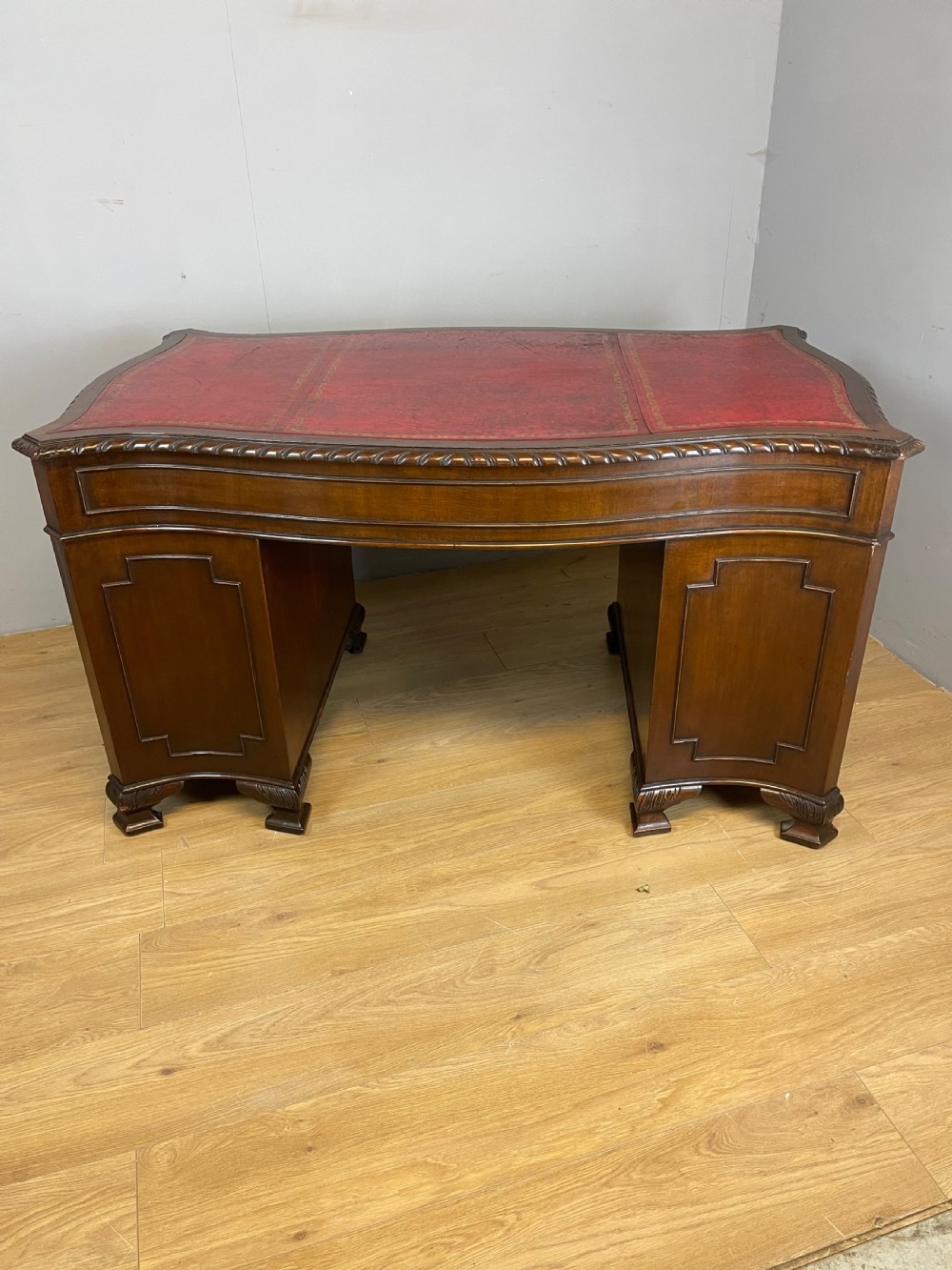 Serpentine sided Chippendale style mahogany desk with inset leather top View XIII