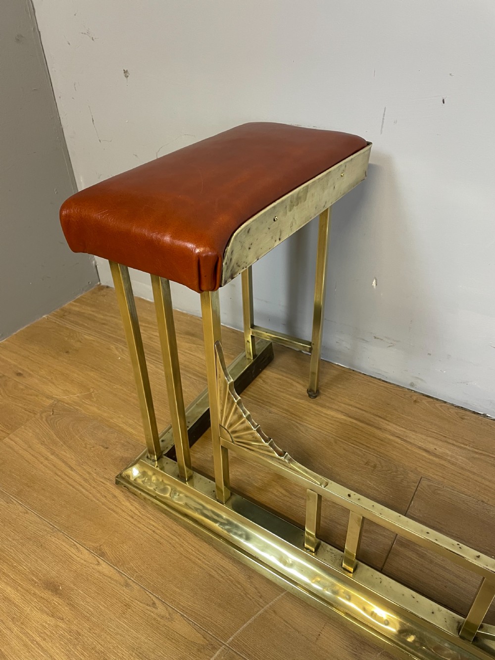 Edwardian brass and leather club fender View III