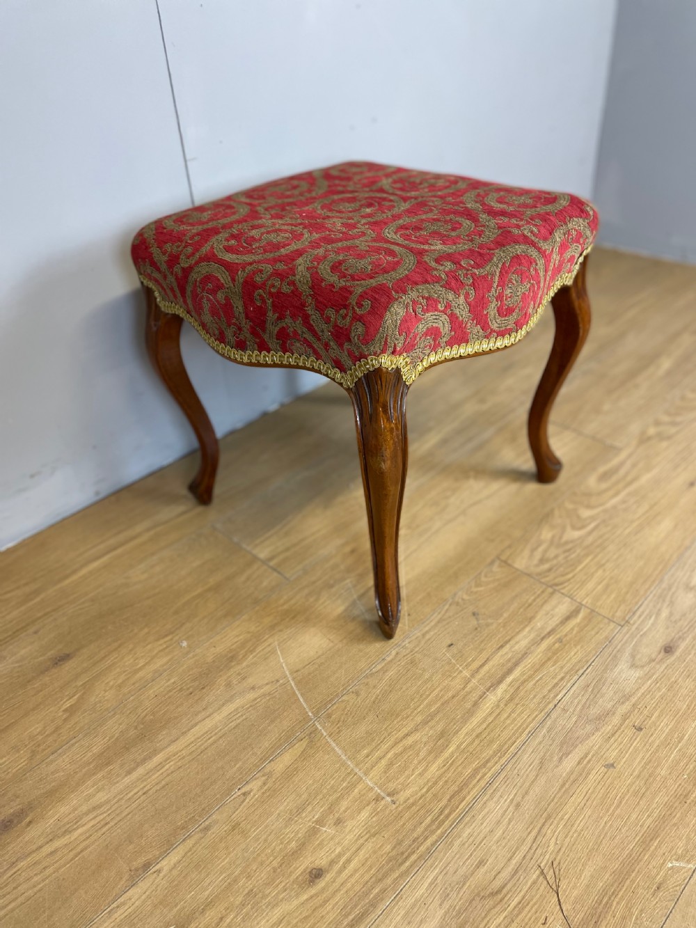 Nineteenth century serpentine stool with walnut cabriole legs 