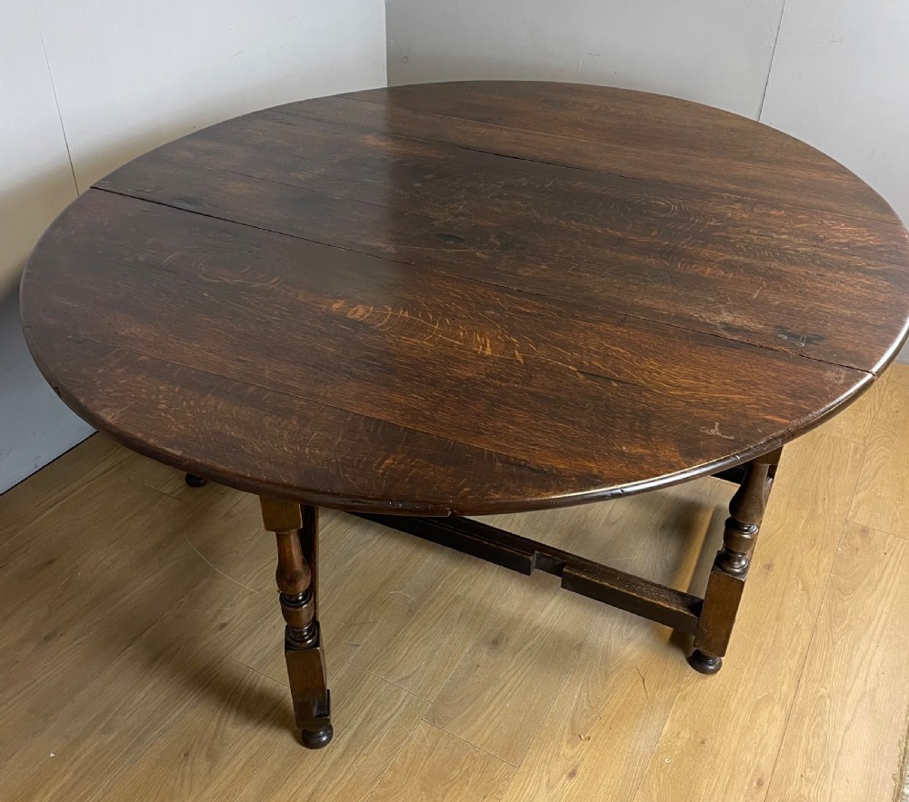 Large early nineteenth century 8 seater oak drop leaf dining table  View II