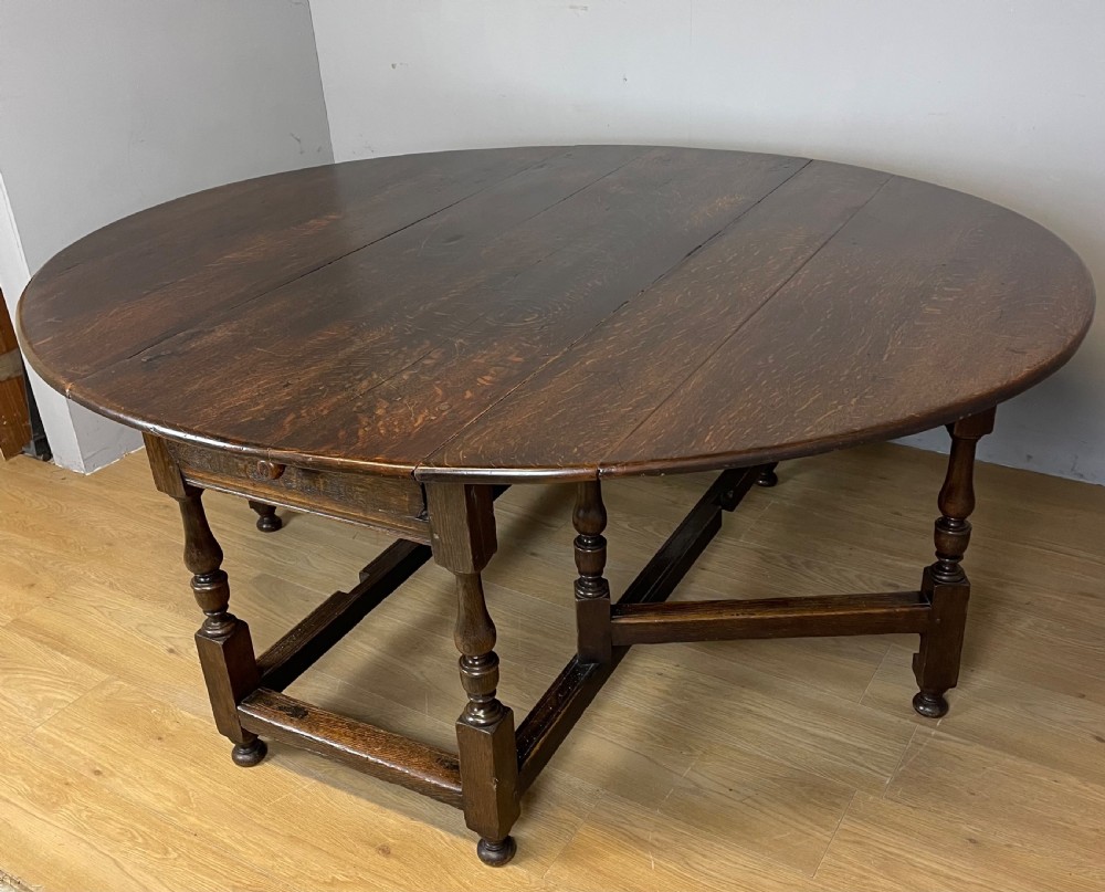 Large early nineteenth century 8 seater oak drop leaf dining table  View VI