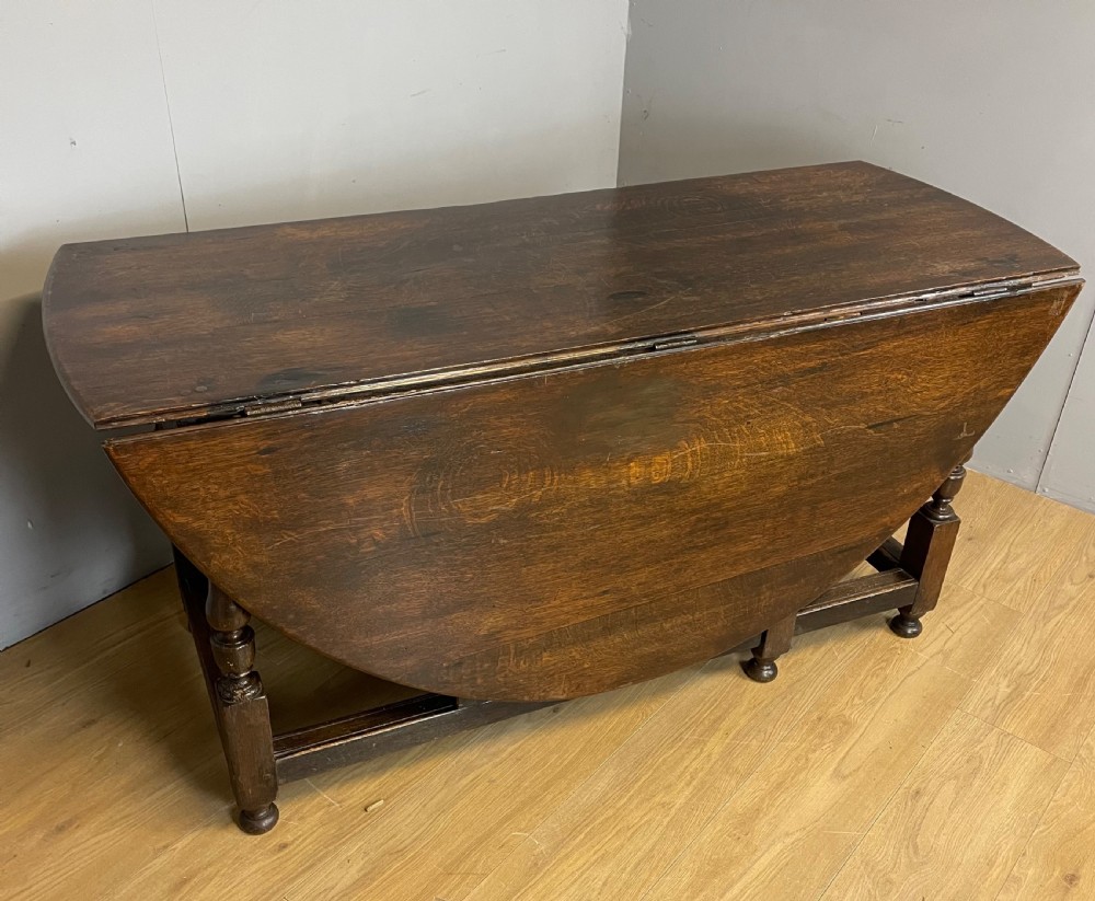 Large early nineteenth century 8 seater oak drop leaf dining table  View IX