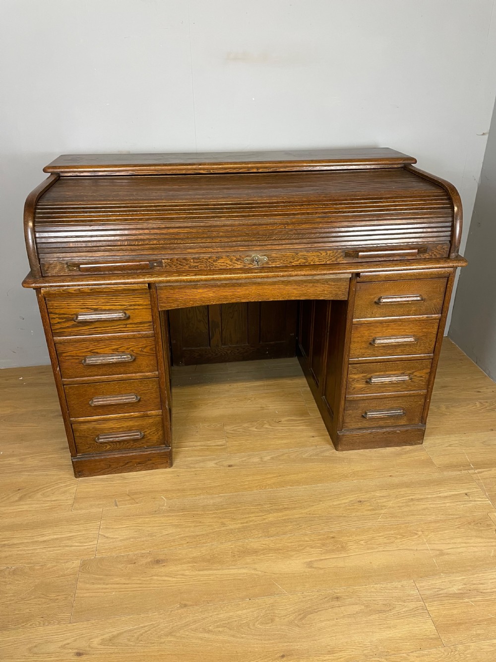 Oak twin pedestal roll top desk circa 1920