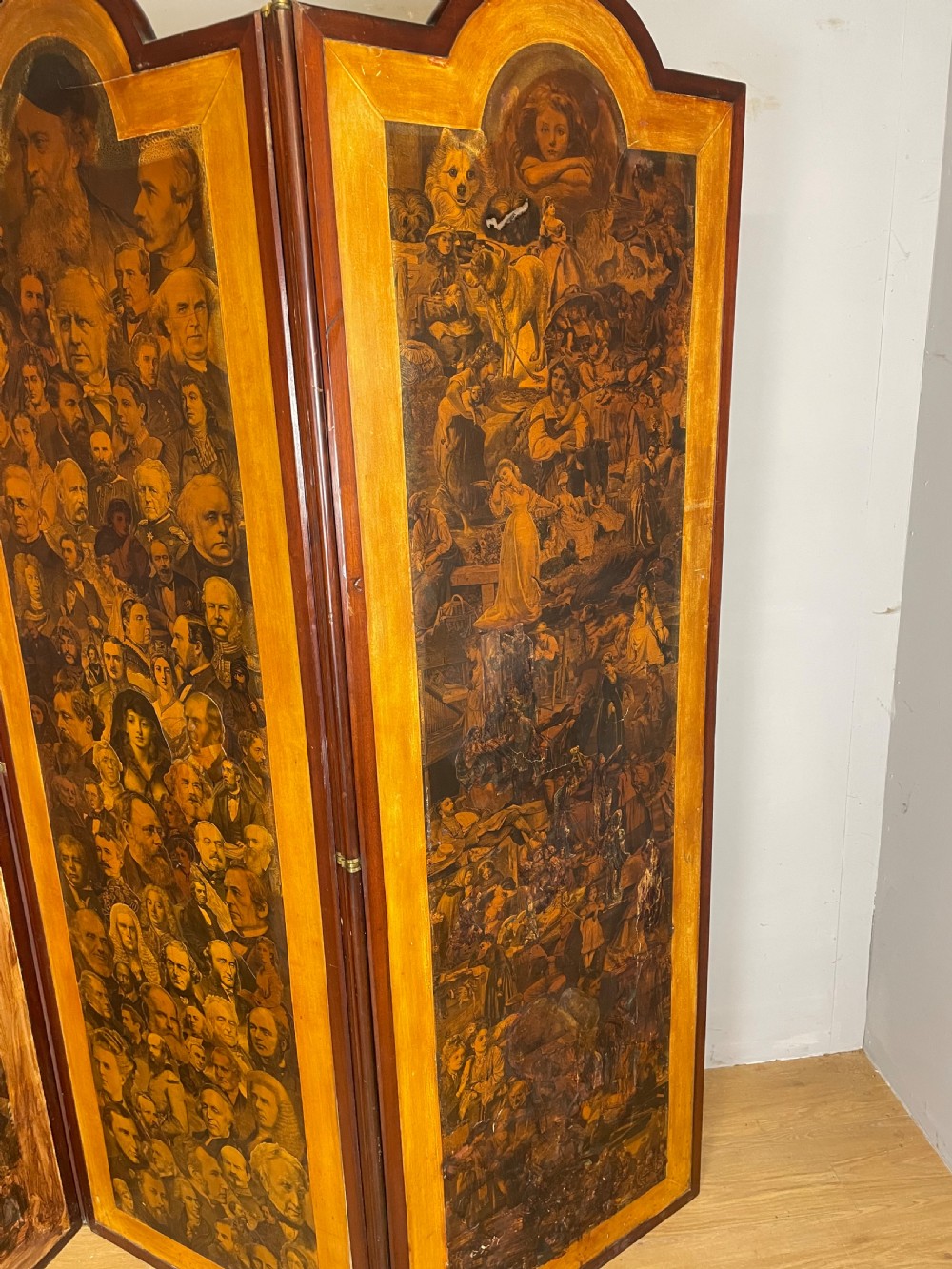 A three-panel wooden folding screen featuring dense Victorian decoupage artwork made of black and white engravings under a clear varnish finish. View II