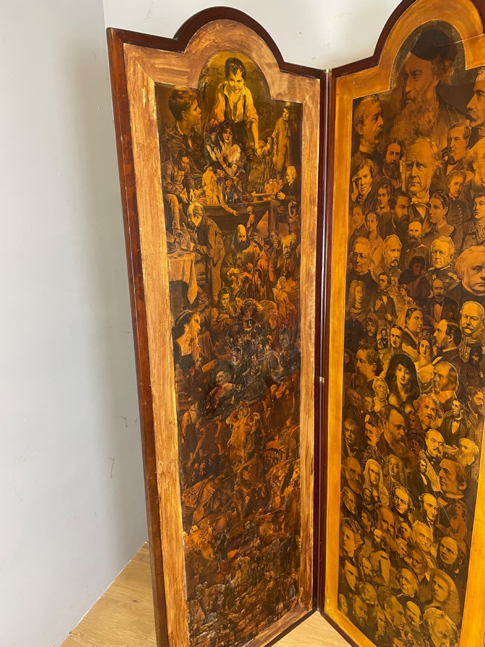 A three-panel wooden folding screen featuring dense Victorian decoupage artwork made of black and white engravings under a clear varnish finish. View IV