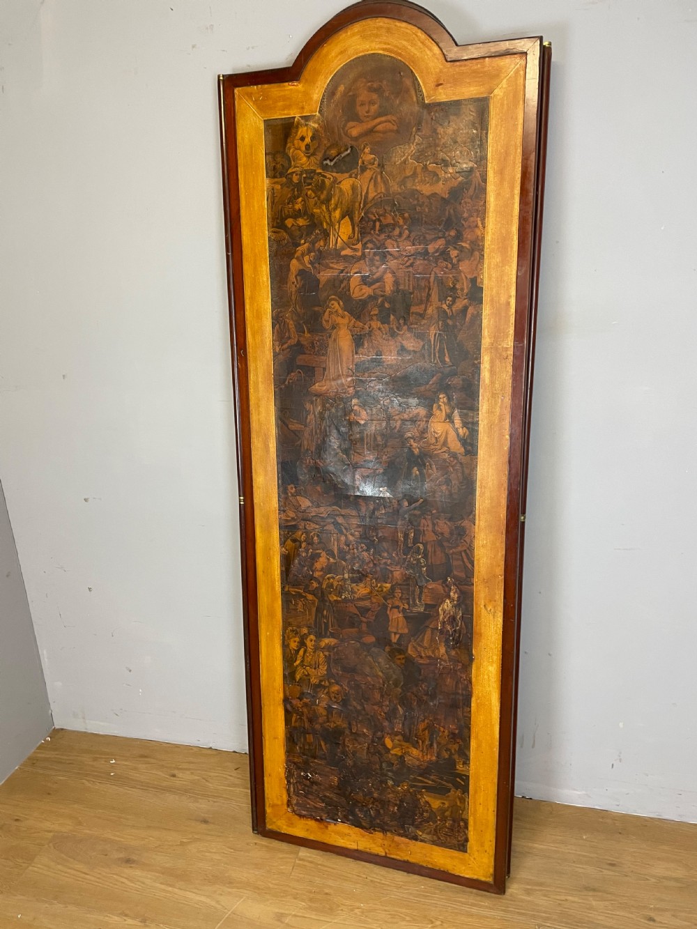 A three-panel wooden folding screen featuring dense Victorian decoupage artwork made of black and white engravings under a clear varnish finish. View XIV