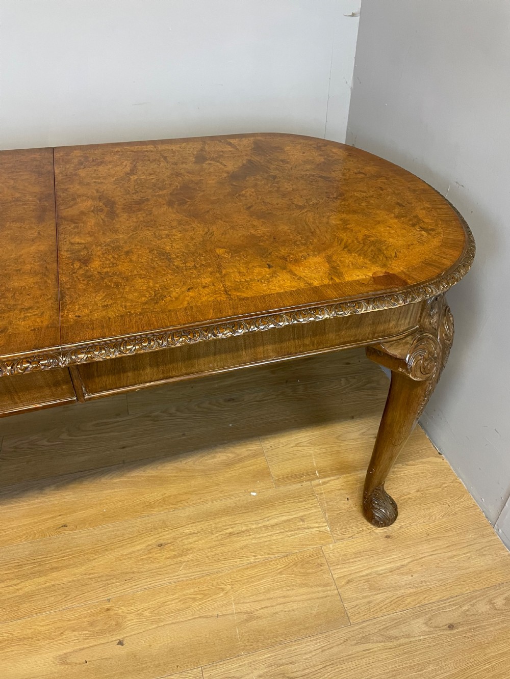 Burr walnut extending dining table on carved cabriole legs  View IV