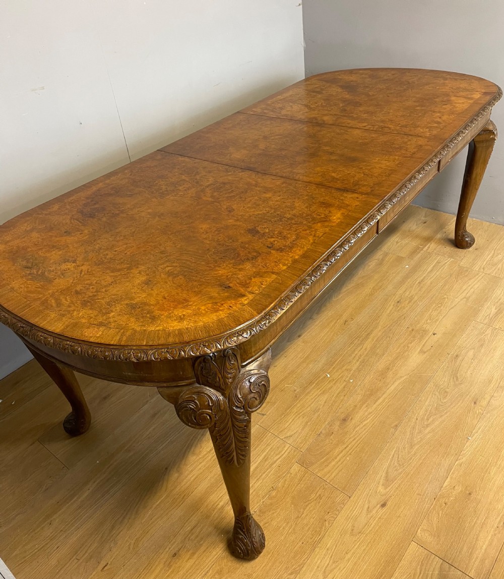 Burr walnut extending dining table on carved cabriole legs  View VI