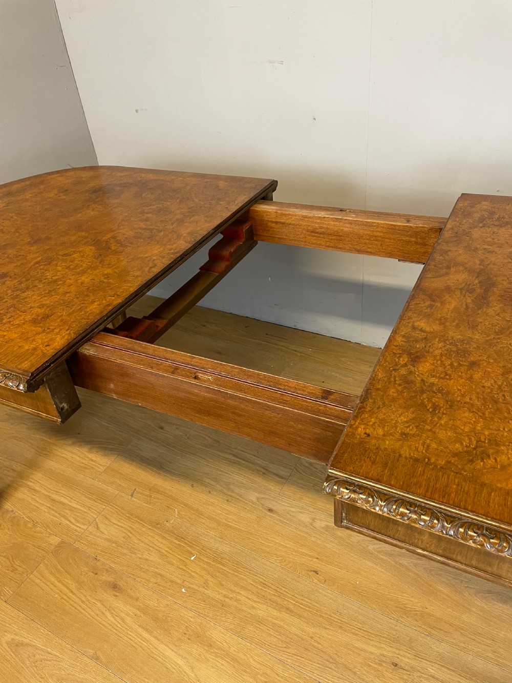Burr walnut extending dining table on carved cabriole legs  View IX