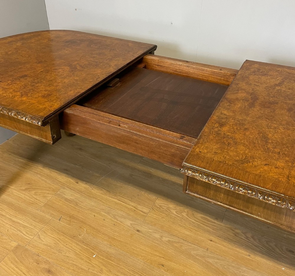 Burr walnut extending dining table on carved cabriole legs  View XI