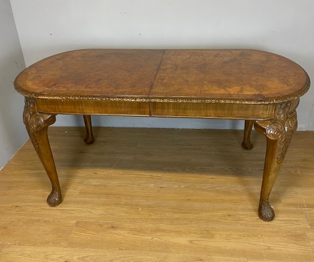 Burr walnut extending dining table on carved cabriole legs  View XII