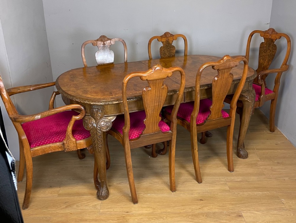 Burr walnut extending dining table on carved cabriole legs  View XIII