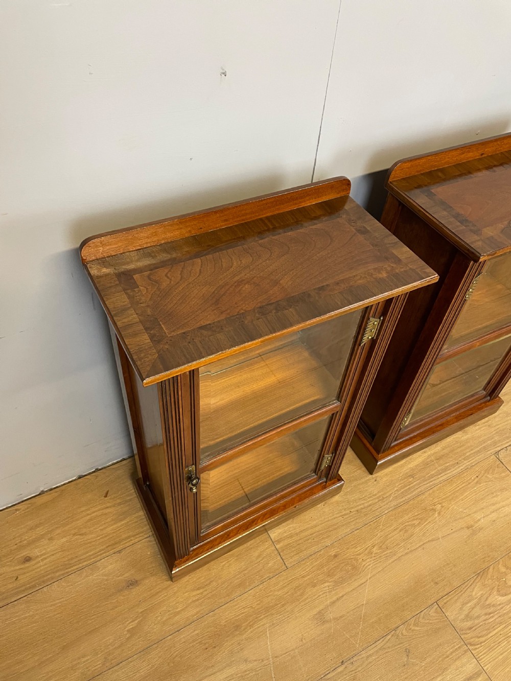 Small  pair of freestanding glazed walnut cabinets  View II