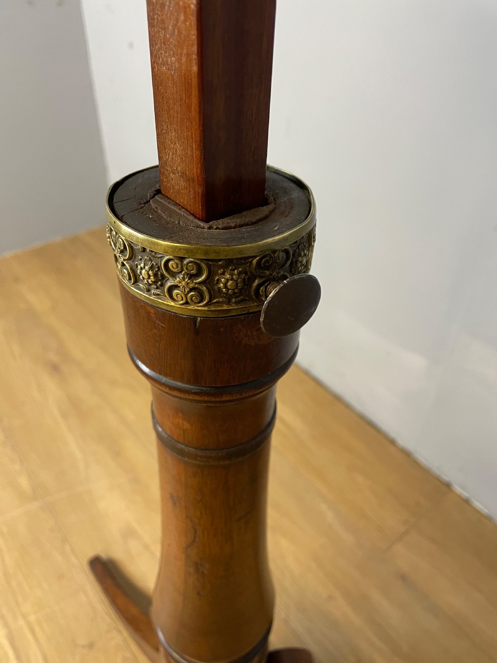 A 19th-century mahogany duet music stand featuring a double-sided adjustable reading frame on a turned column with brass fittings and tripod base. View VIII