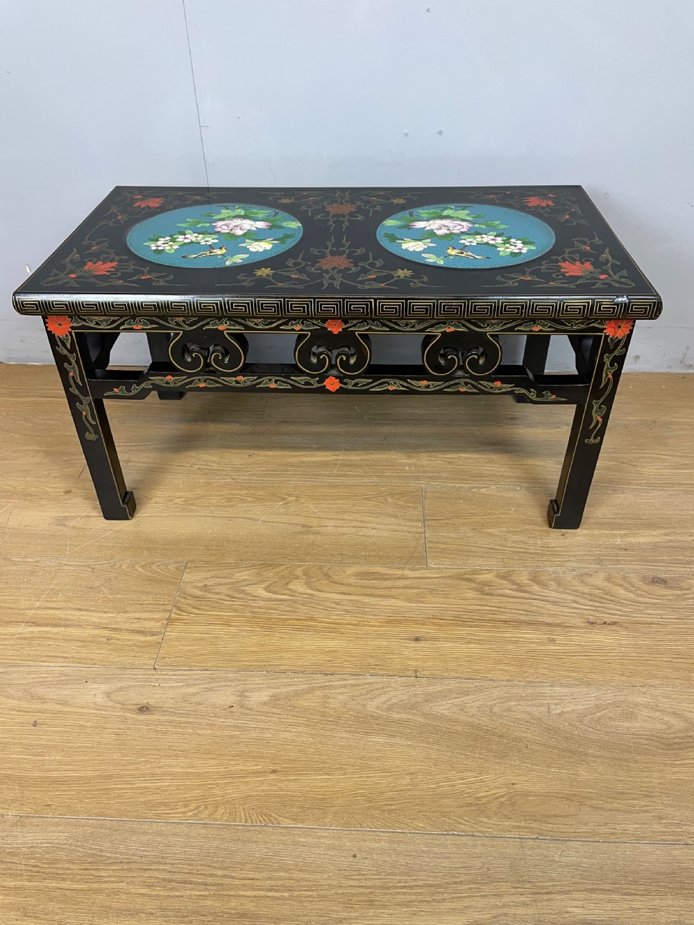 Early C20th chinoiserie coffee table with cloisonné panels 