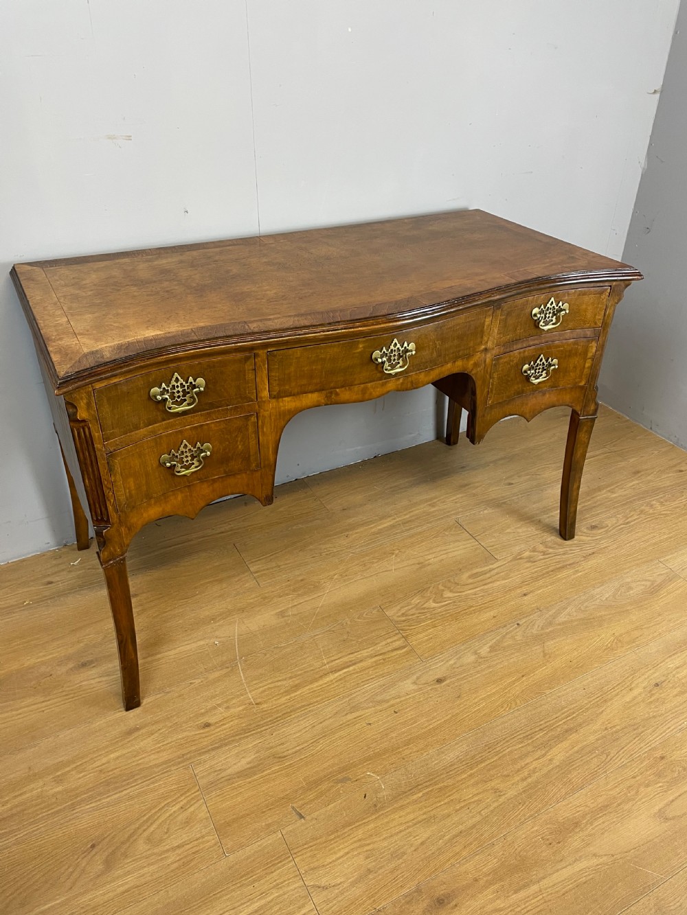 Edwardian serpentine front walnut writing desk 