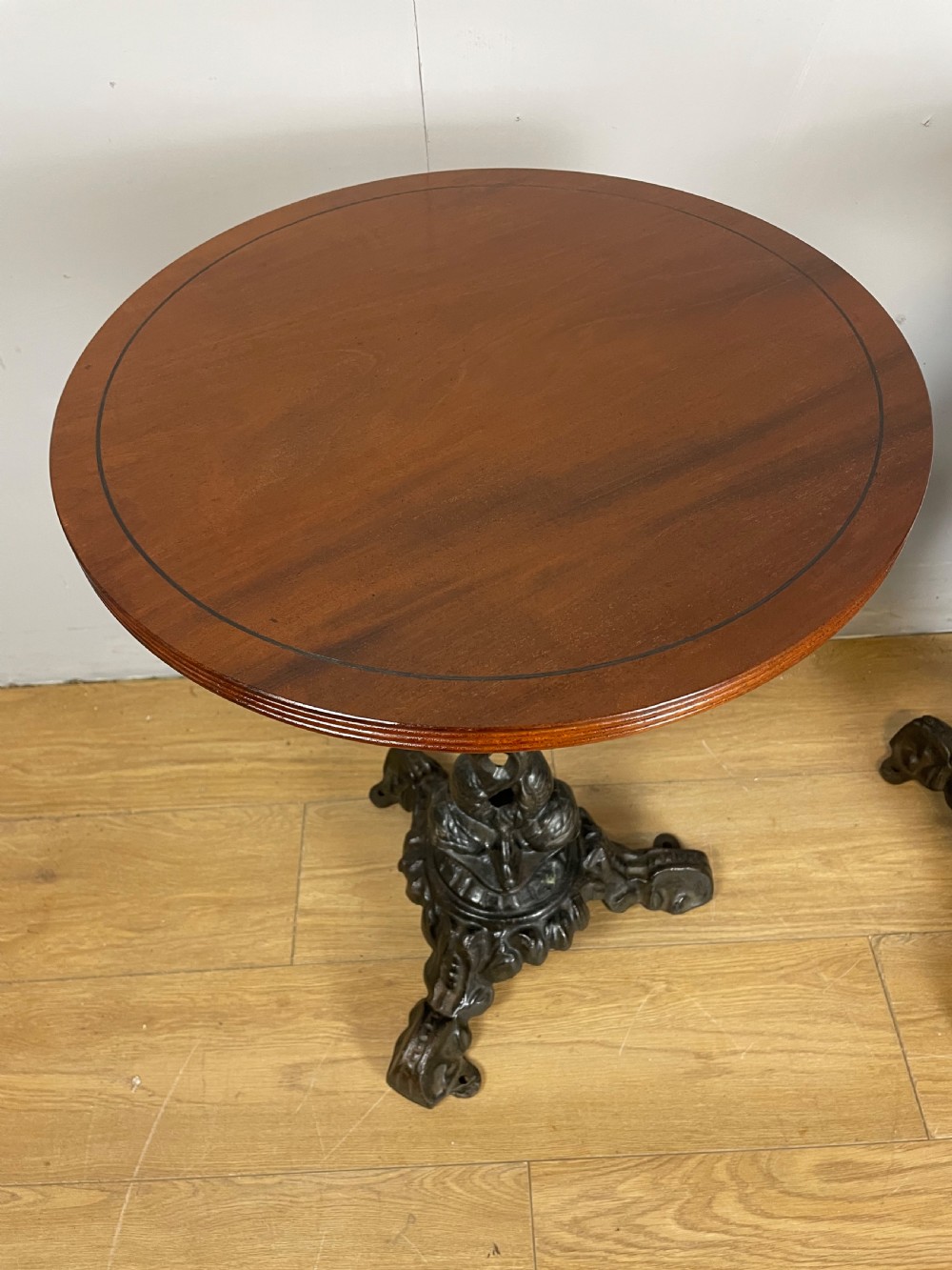 C19TH pair of cast iron tables with mahogany to tops  View III