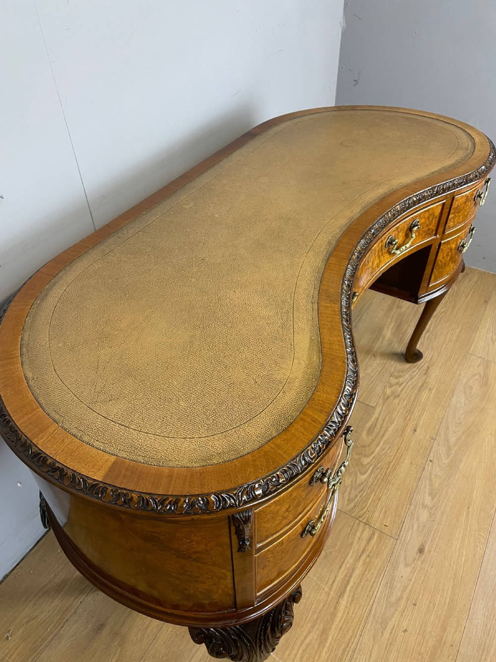 Burr walnut kidney shaped desk with inset leather top View V