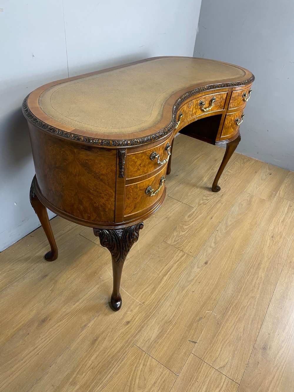 Burr walnut kidney shaped desk with inset leather top View VI