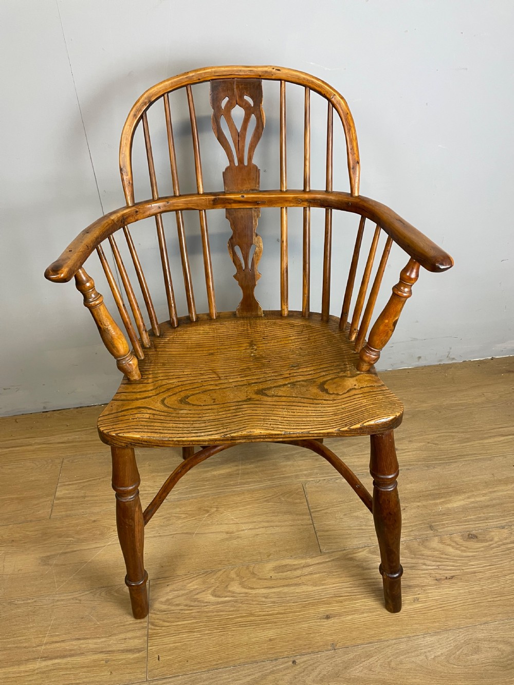 Early nineteenth century yew and elm Windsor chair with crinoline under stretcher  View II