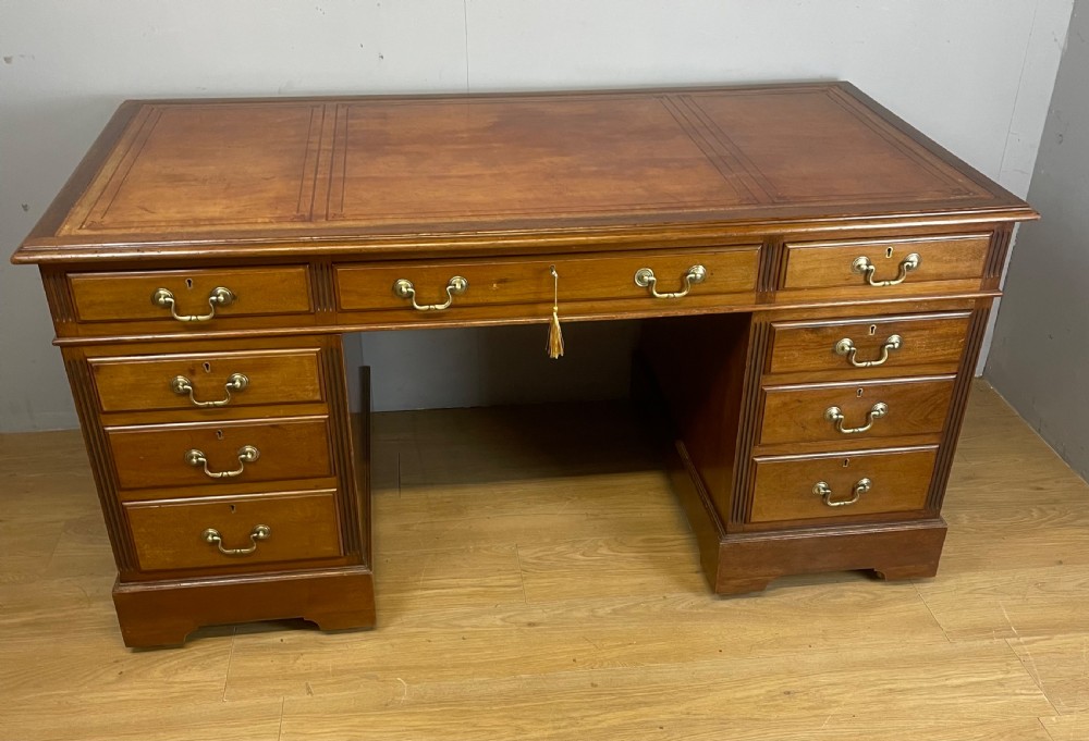 Edwardian twin pedestal mahogany desk with inset leather top 