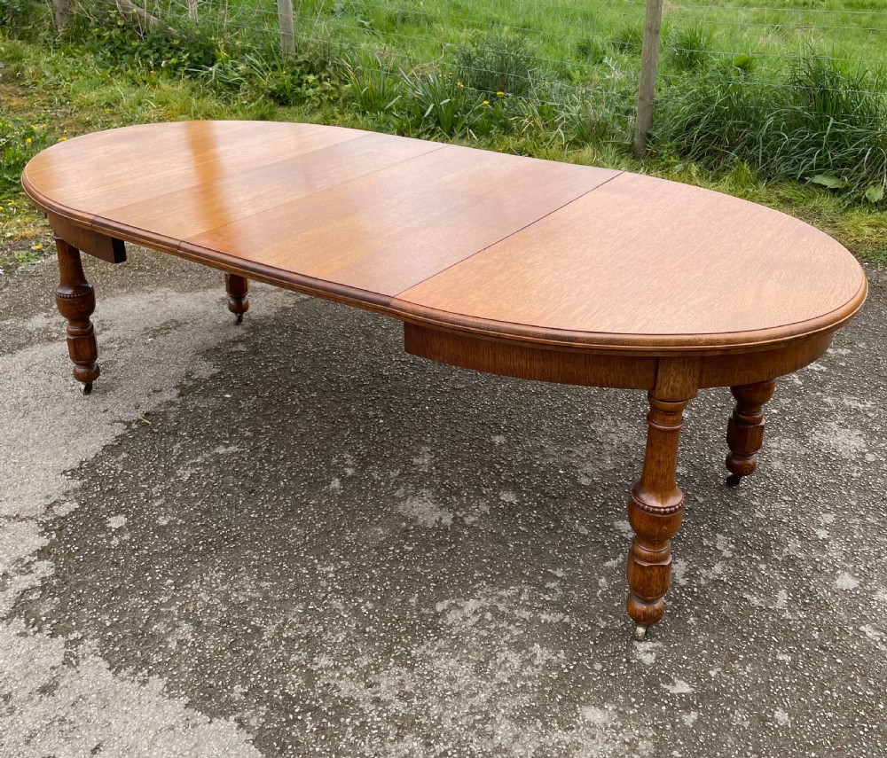 Large Arts and crafts golden oak wind out dining table 