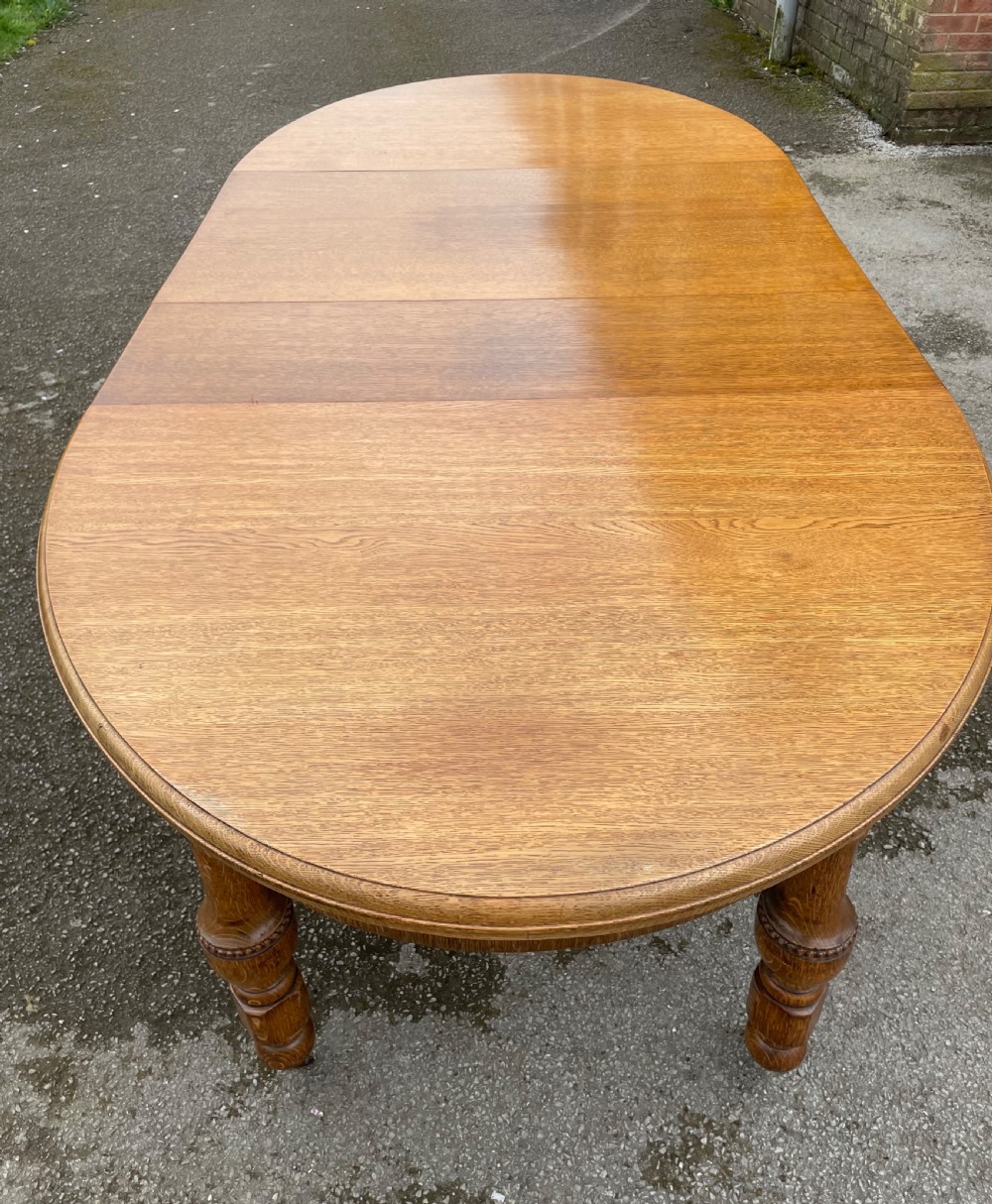 Large Arts and crafts golden oak wind out dining table  View IV
