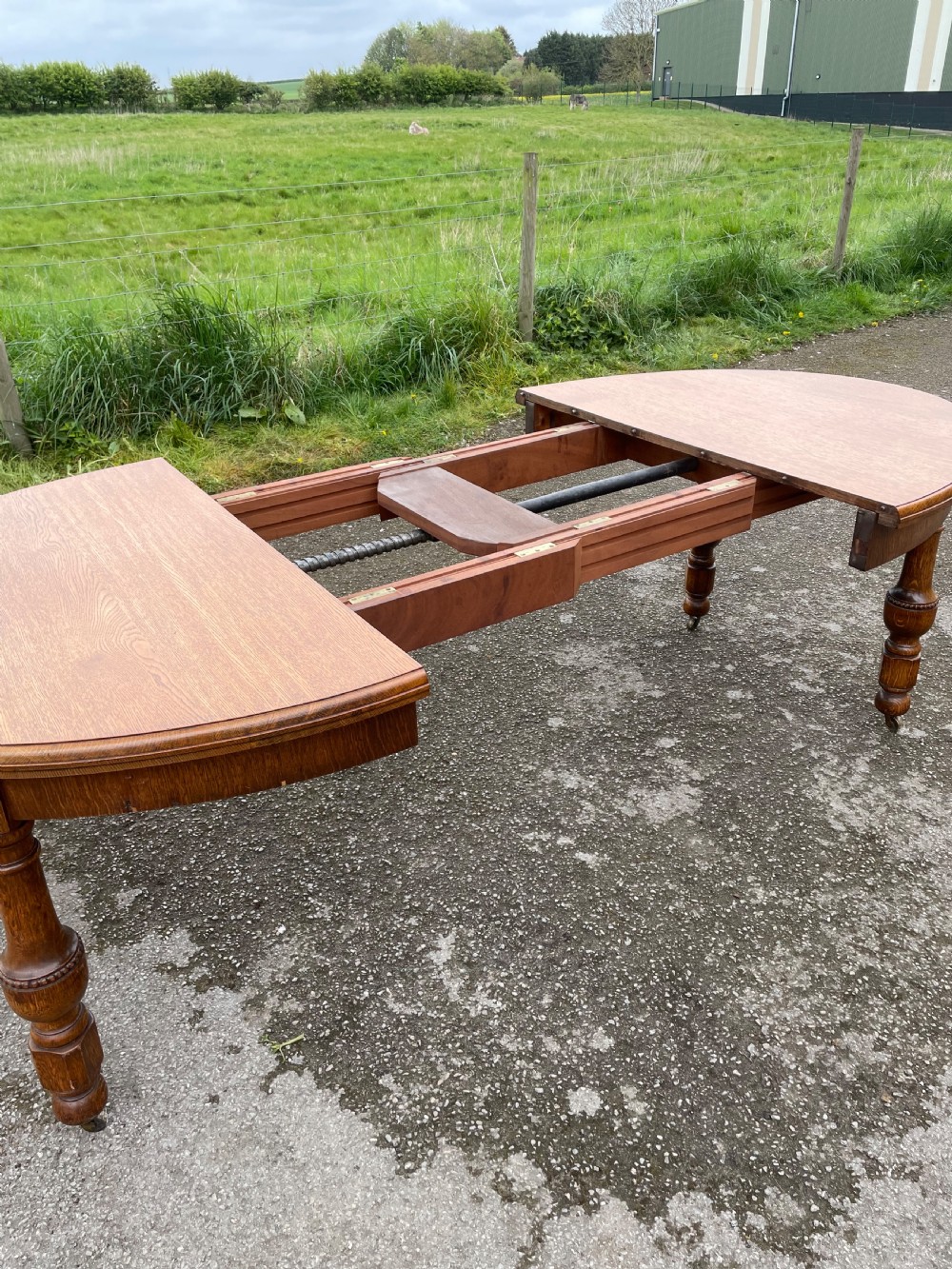Large Arts and crafts golden oak wind out dining table  View VI