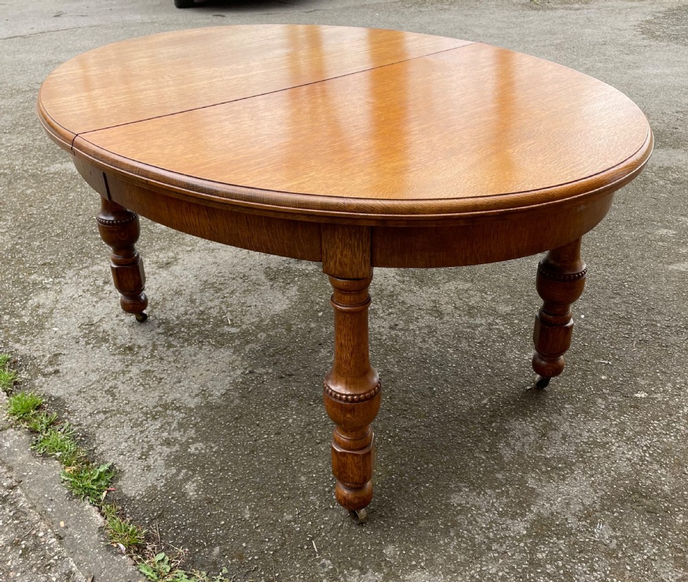 Large Arts and crafts golden oak wind out dining table  View VII