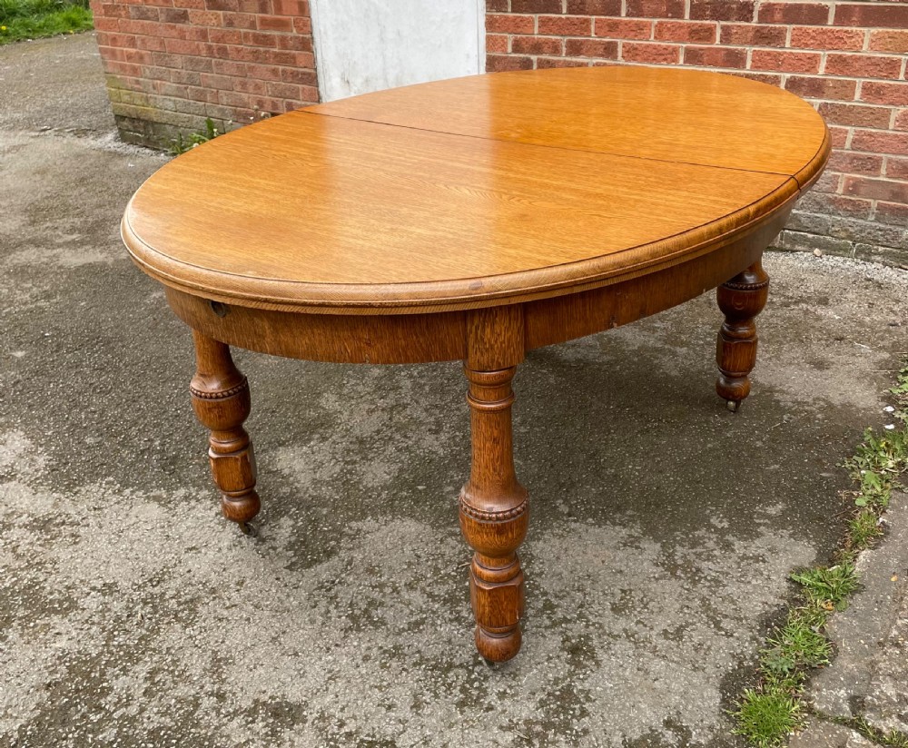 Large Arts and crafts golden oak wind out dining table  View VIII