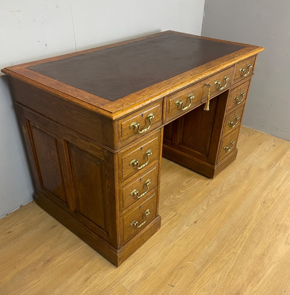 Edwardian solid oak twin pedestal desk with inset leather top  View III