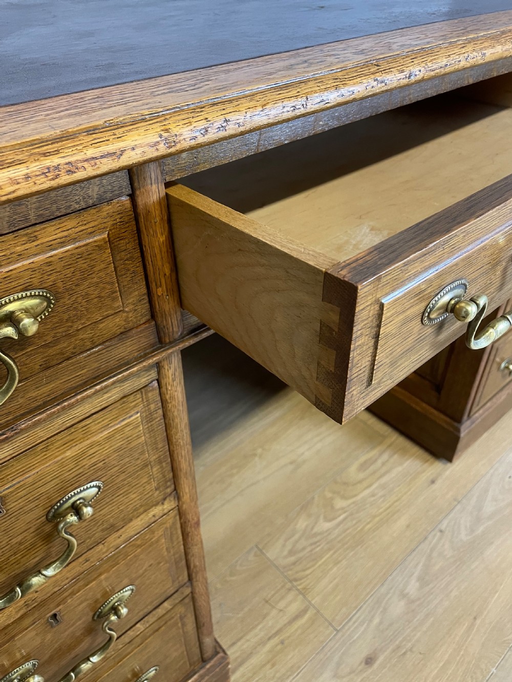 Edwardian solid oak twin pedestal desk with inset leather top  View VII
