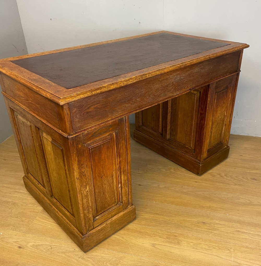 Edwardian solid oak twin pedestal desk with inset leather top  View VIII