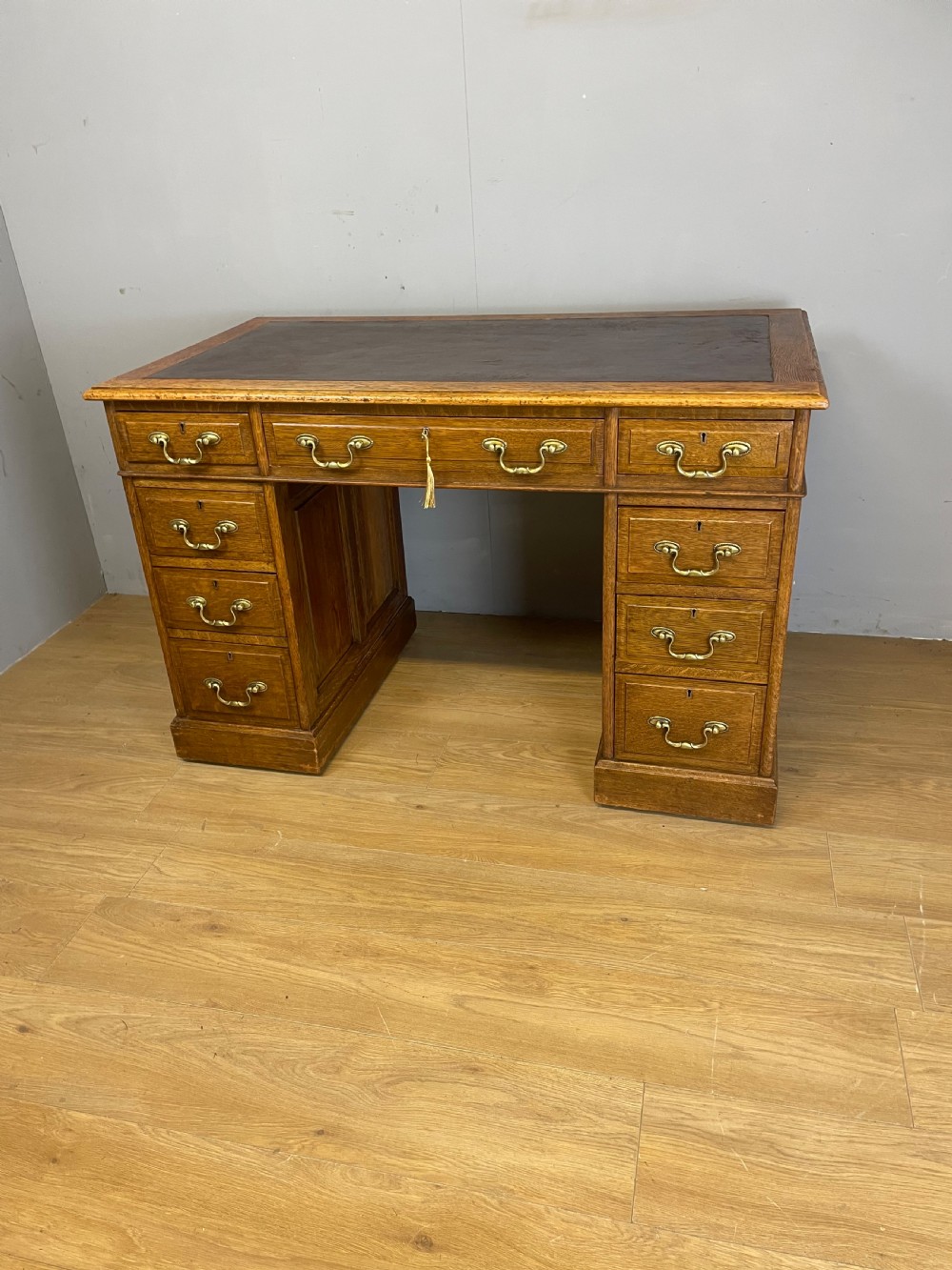 Edwardian solid oak twin pedestal desk with inset leather top  View XI