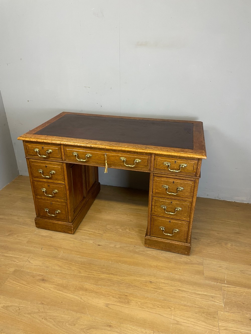 Edwardian solid oak twin pedestal desk with inset leather top  View XII