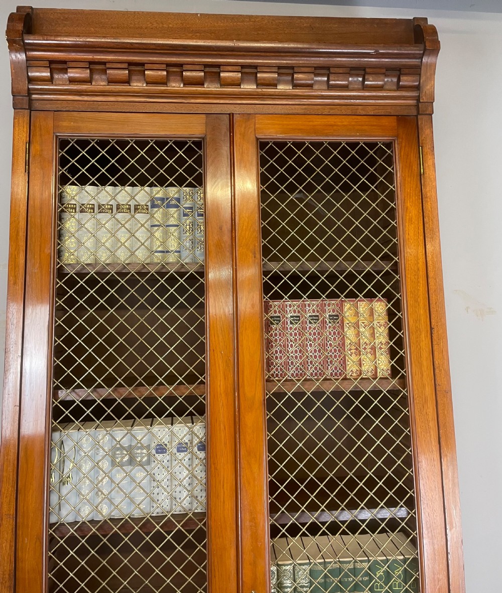 C19TH walnut two door country house bookcase with brass grilles View III