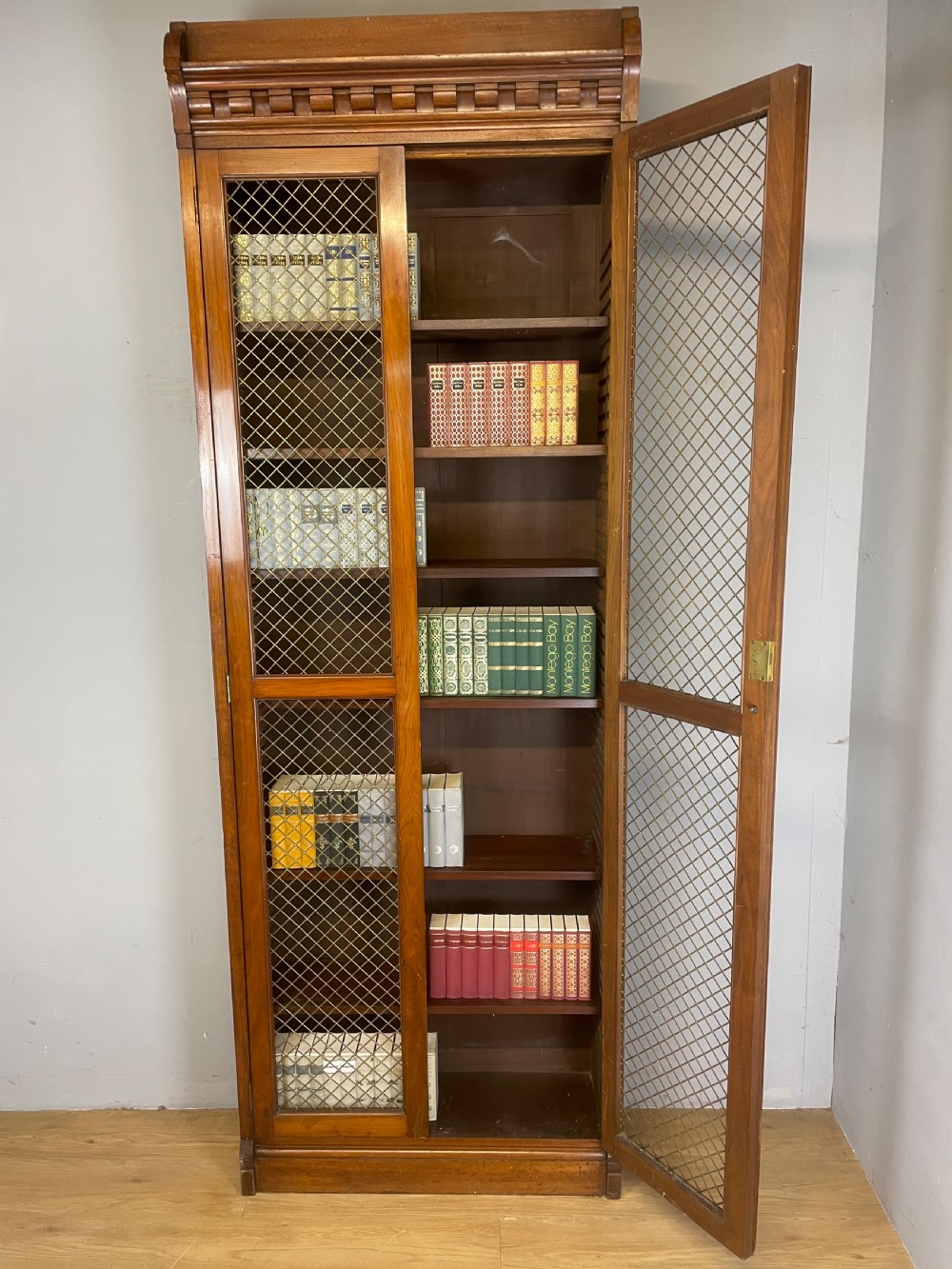 C19TH walnut two door country house bookcase with brass grilles View IX