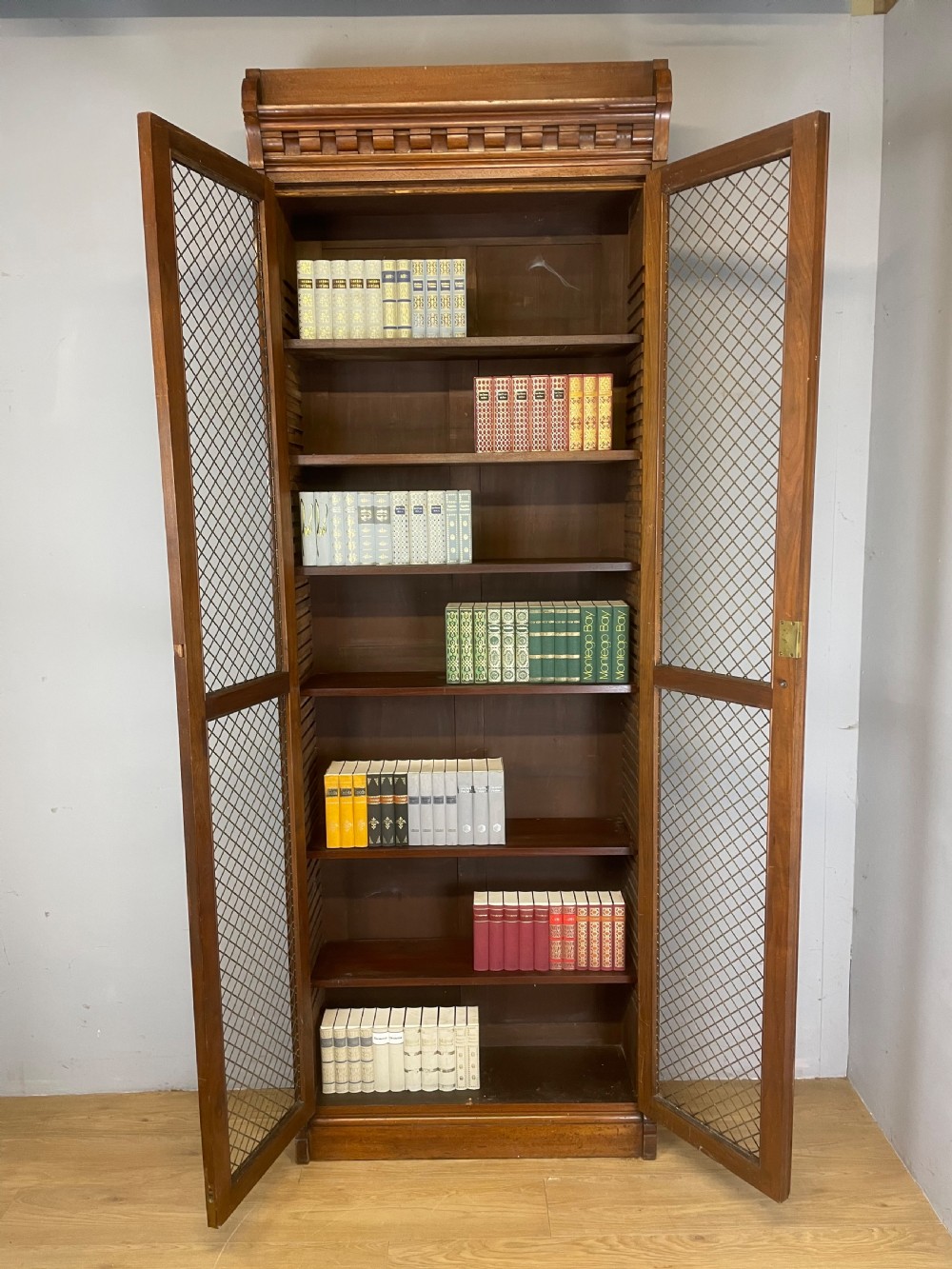 C19TH walnut two door country house bookcase with brass grilles View X