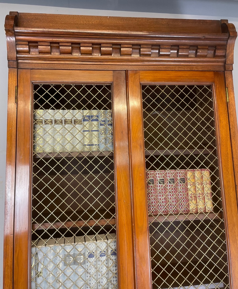 C19TH walnut two door country house bookcase with brass grilles View XI