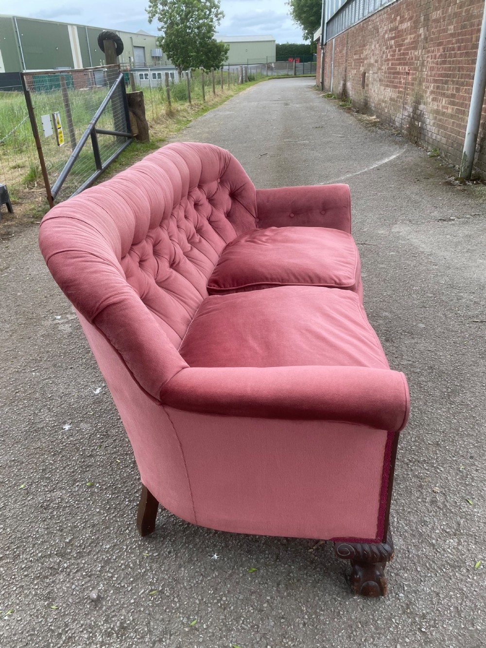 Victorian serpentine front sofa on carved show wood frame  View VII