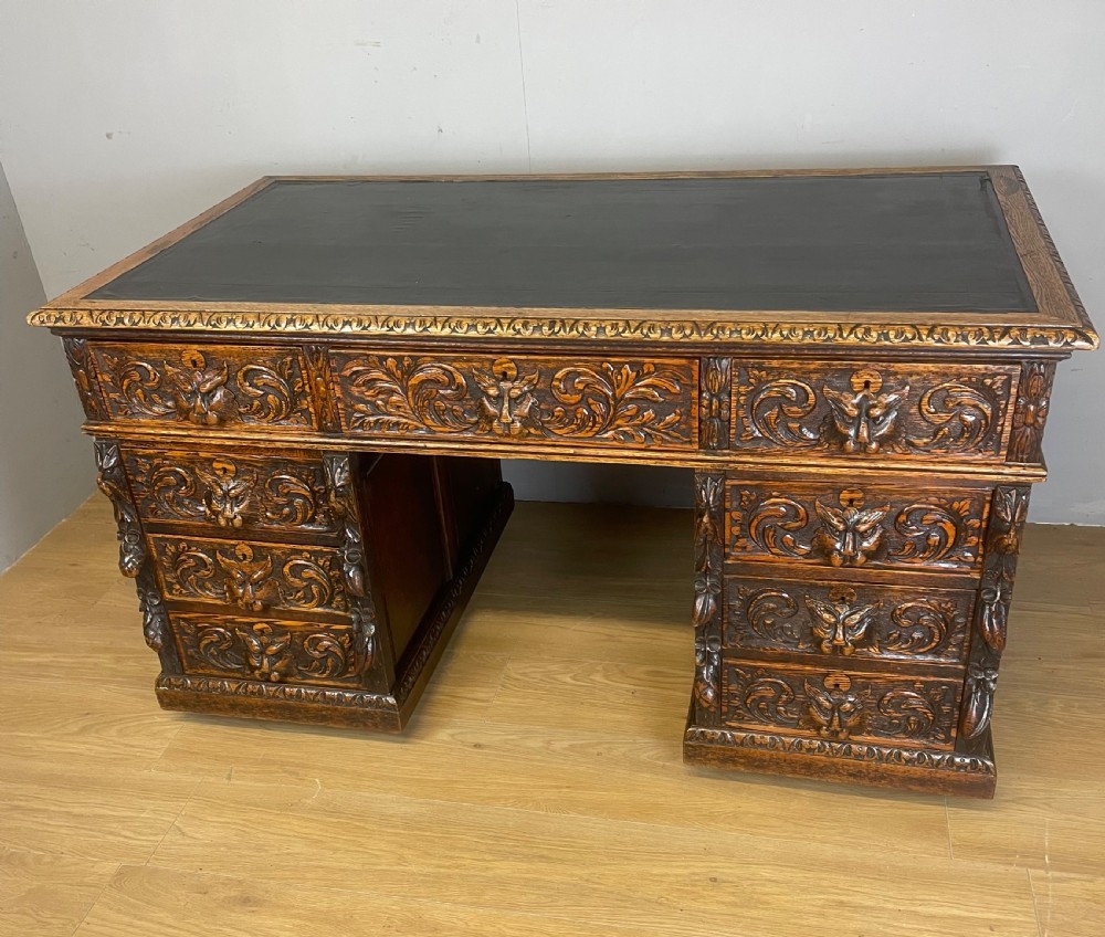 C19TH carved oak twin pedestal desk 